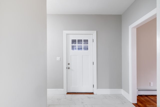 foyer with a baseboard heating unit