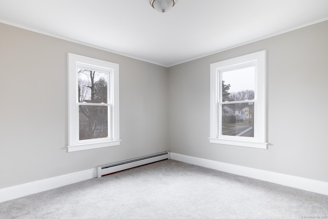 unfurnished room featuring baseboard heating, crown molding, and carpet