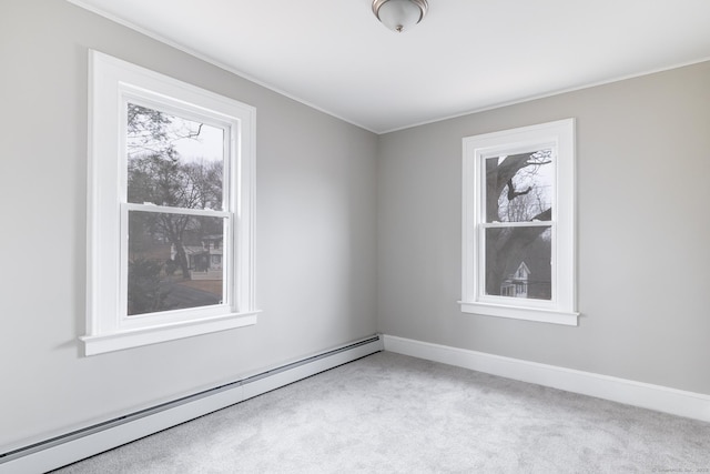 unfurnished room with light carpet and baseboard heating