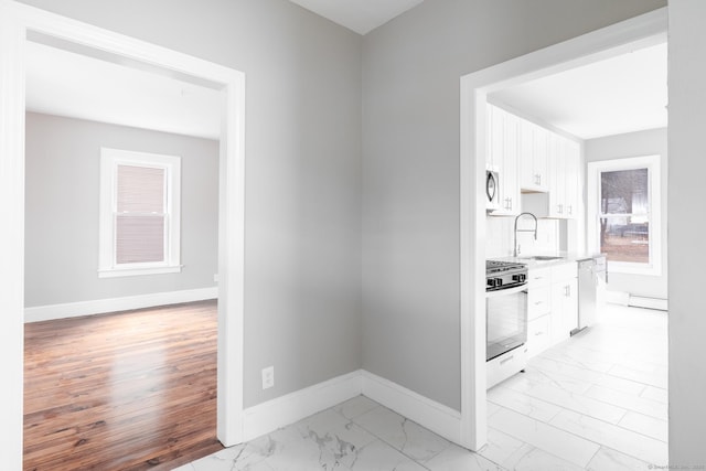 hallway featuring sink