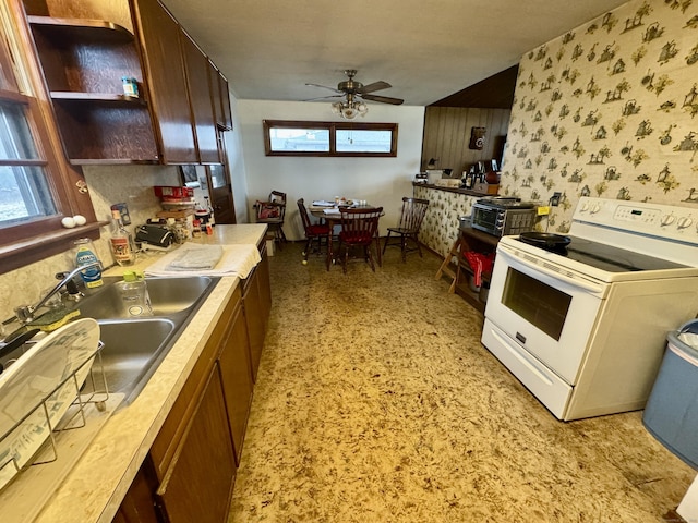 kitchen with sink, ceiling fan, and white range with electric cooktop