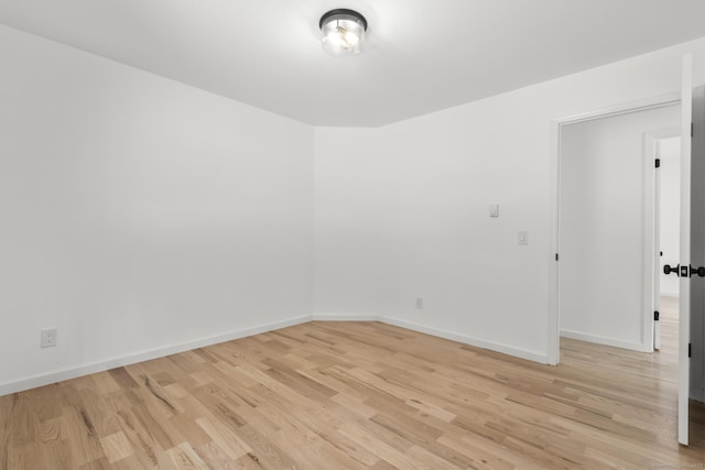 unfurnished room featuring light hardwood / wood-style floors