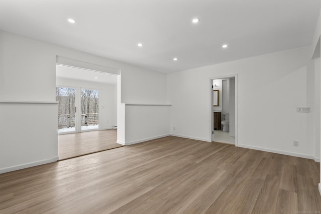 unfurnished living room featuring light hardwood / wood-style flooring