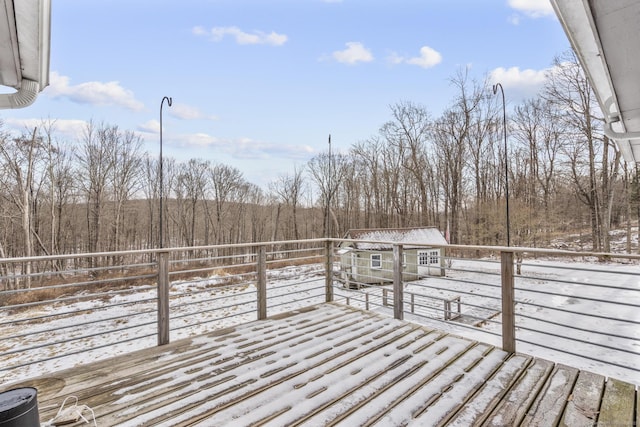 view of snow covered deck