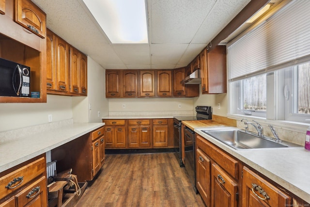 15 Seeley St, Danbury, CT 06810 - kitchen with a sink, a drop ceiling, black microwave, brown cabinetry, and light countertops
