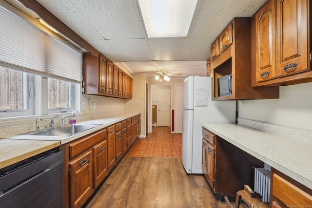 15 Seeley St, Danbury, CT 06810 - kitchen with a sink, dishwasher, light countertops, brown cabinets, and a paneled ceiling