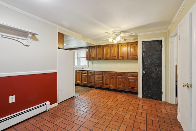 15 Seeley St, Danbury, CT 06810 - kitchen with a baseboard heating unit, freestanding refrigerator, brick floors, light countertops, and crown molding