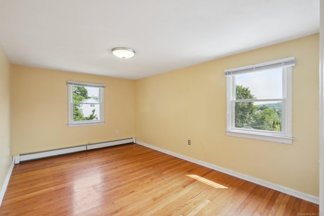 15 Seeley St, Danbury, CT 06810 - unfurnished room featuring a baseboard radiator, light wood finished floors, and baseboards