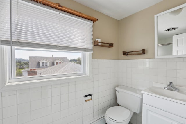 15 Seeley St, Danbury, CT 06810 - bathroom featuring toilet, vanity, tile walls, wainscoting, and a shower