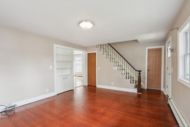 15 Seeley St, Danbury, CT 06810 - foyer with a baseboard heating unit, wood finished floors, stairway, and baseboards