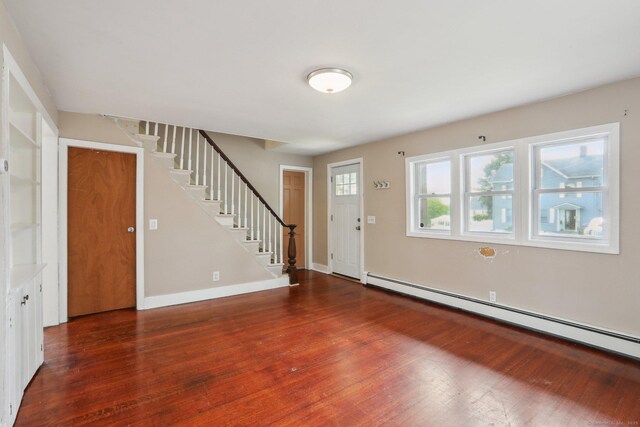 15 Seeley St, Danbury, CT 06810 - foyer entrance with baseboard heating, wood finished floors, stairs, and baseboards