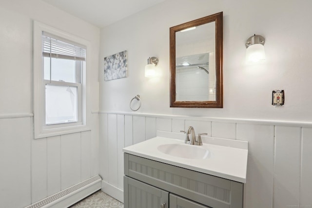 15 Seeley St, Danbury, CT 06810 - full bath with a baseboard radiator, vanity, a wainscoted wall, and a decorative wall