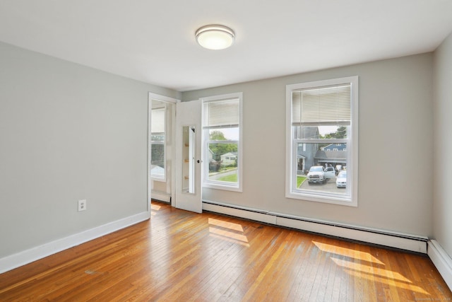 15 Seeley St, Danbury, CT 06810 - unfurnished room featuring a baseboard radiator, hardwood / wood-style flooring, and baseboards