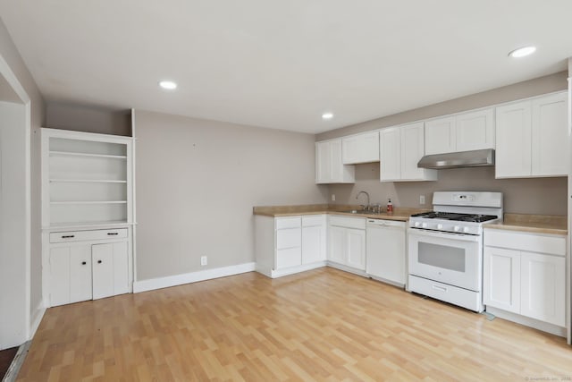 15 Seeley St, Danbury, CT 06810 - kitchen featuring white appliances, under cabinet range hood, light wood finished floors, white cabinetry, and baseboards