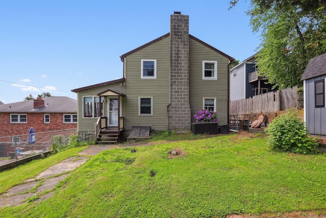 15 Seeley St, Danbury, CT 06810 - rear view of house with a chimney
