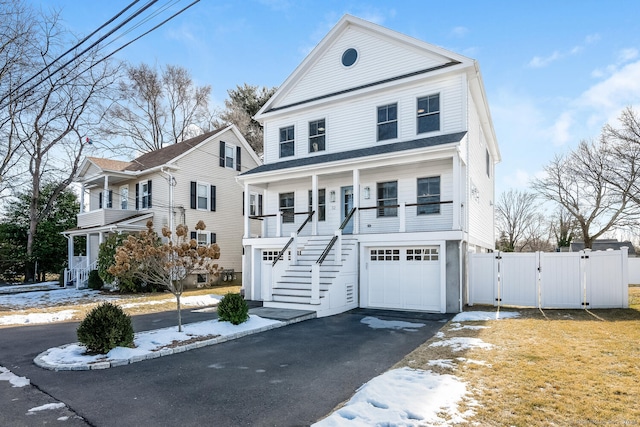 view of front of home featuring a garage and covered porch