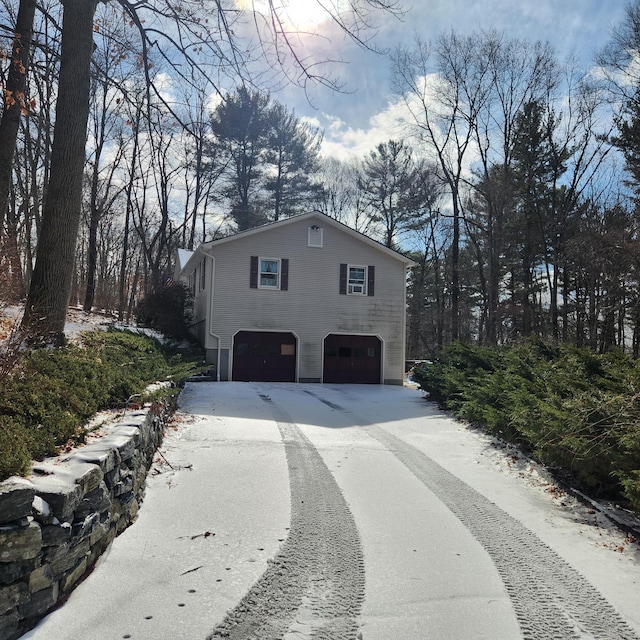 view of side of property with a garage