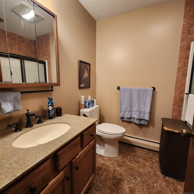 bathroom featuring vanity, a baseboard heating unit, a textured ceiling, and toilet