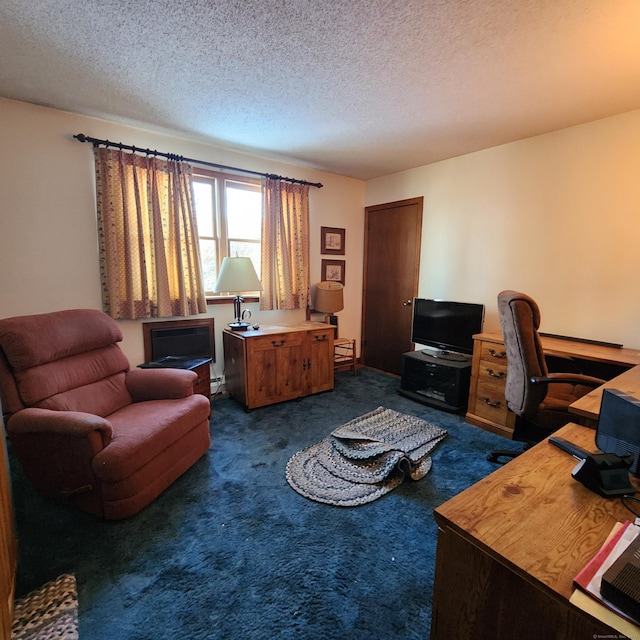 carpeted office with a textured ceiling