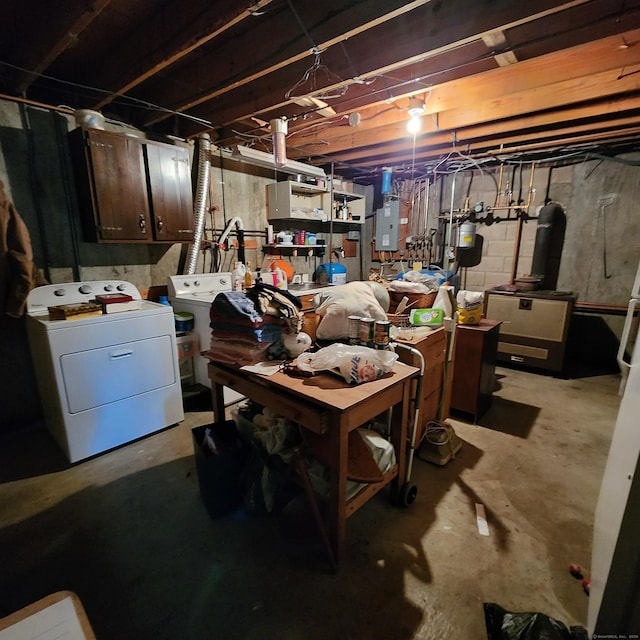 basement featuring separate washer and dryer and electric panel