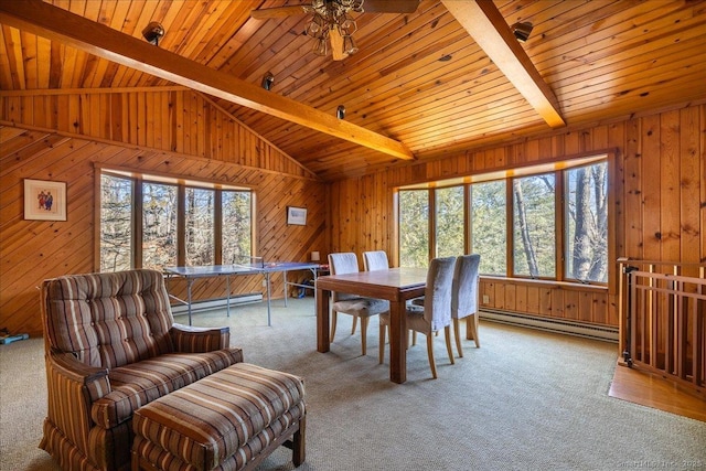 dining space featuring a baseboard radiator, wooden walls, light colored carpet, and vaulted ceiling with beams