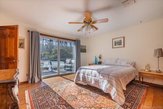 bedroom featuring access to outside, ceiling fan, and light wood-type flooring