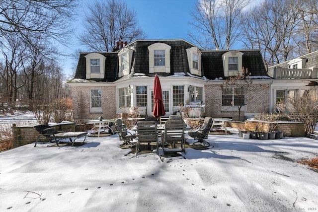 view of snow covered house