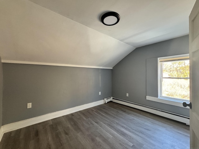 bonus room with a baseboard heating unit, vaulted ceiling, and hardwood / wood-style floors