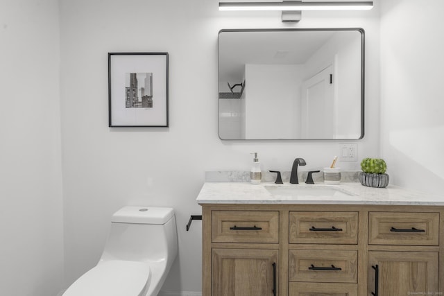 bathroom with vanity and toilet