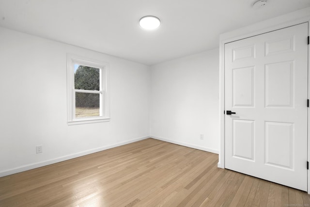 unfurnished room with light hardwood / wood-style floors