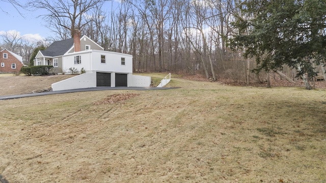 view of yard with a garage