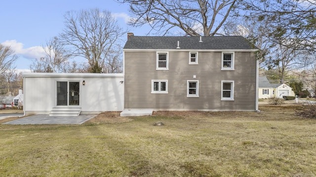 back of house with a yard and a patio area