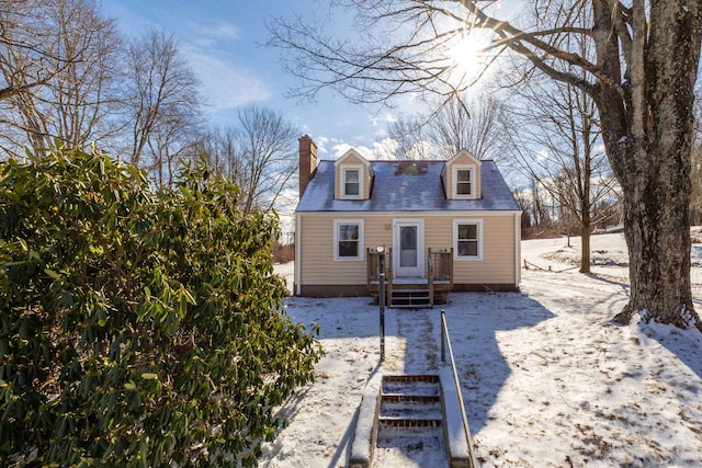 view of snow covered house