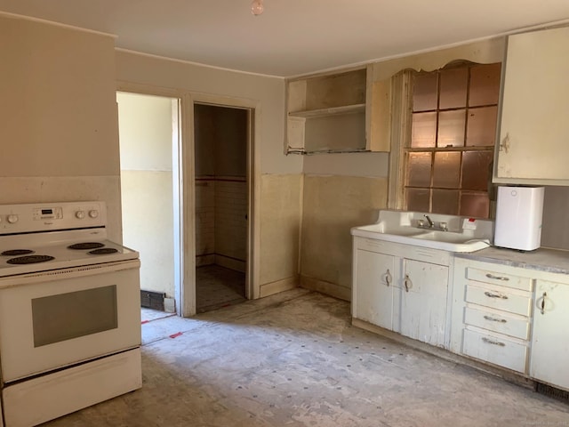 kitchen with sink and electric range