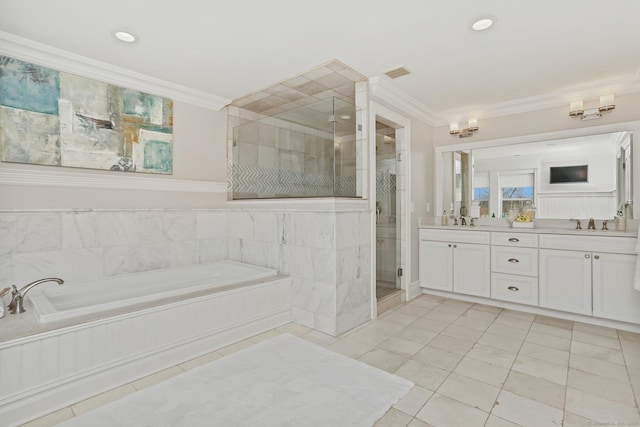 full bath with double vanity, visible vents, ornamental molding, a garden tub, and a sink