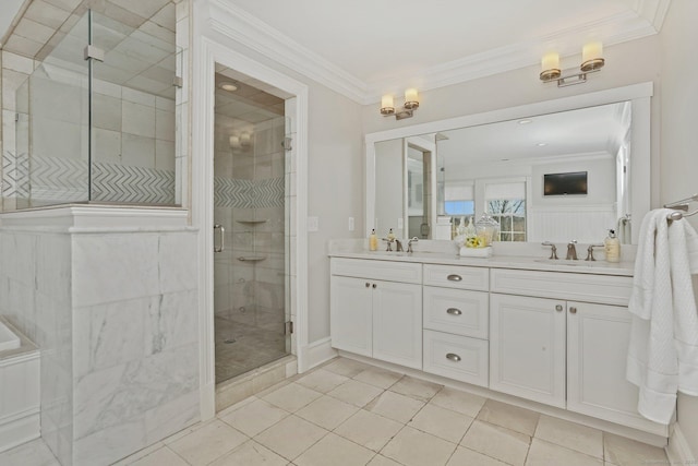 full bath featuring a sink, double vanity, ornamental molding, and a shower stall