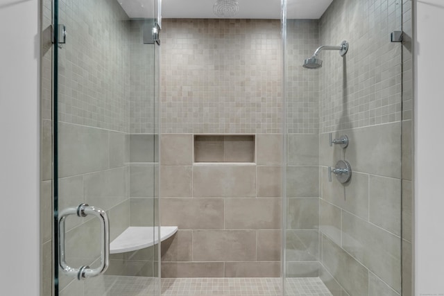 bathroom with a shower with shower door