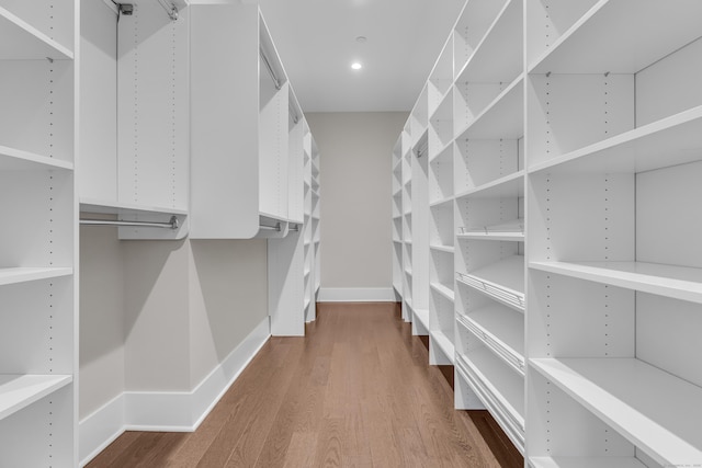 walk in closet featuring hardwood / wood-style floors