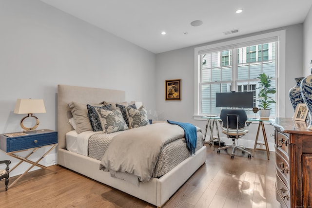 bedroom with light hardwood / wood-style floors