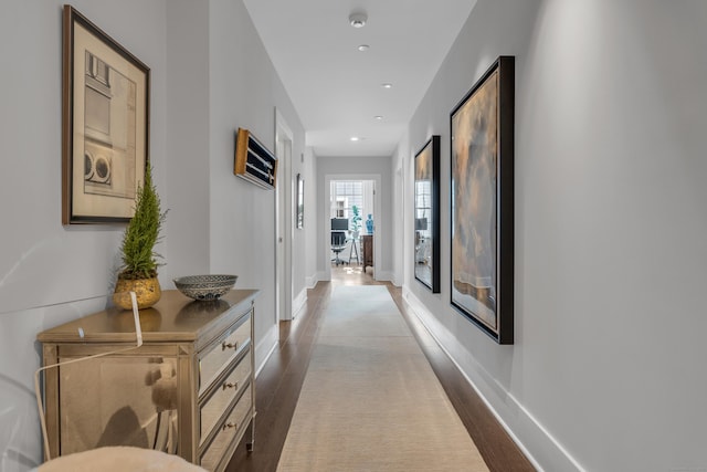 hall with dark hardwood / wood-style floors