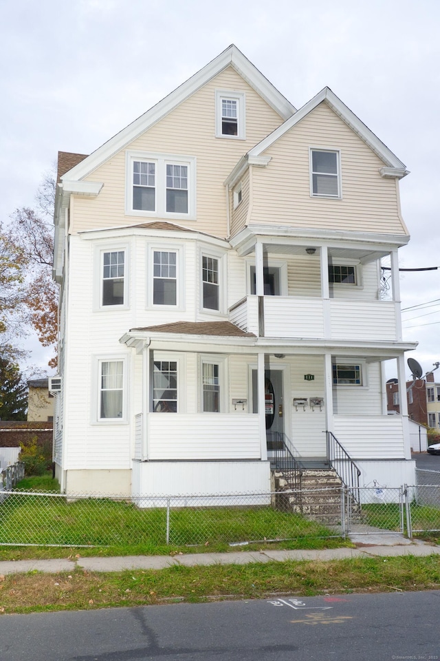 view of front of home with a porch and a balcony