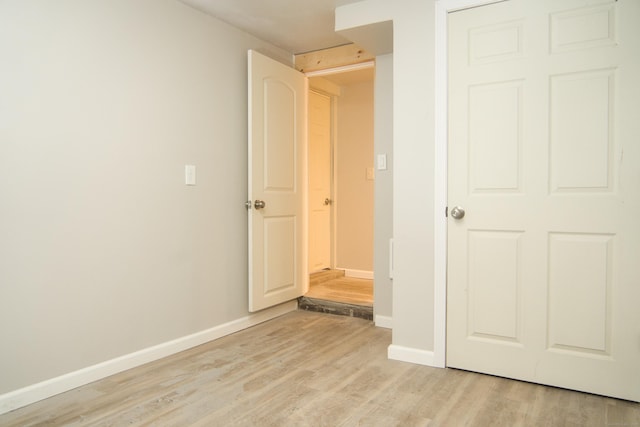 unfurnished bedroom featuring light wood-type flooring