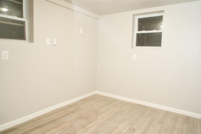 spare room with hardwood / wood-style floors