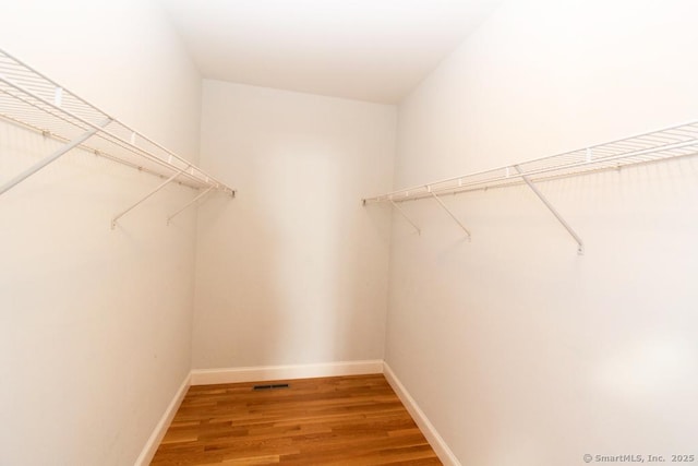 spacious closet featuring wood-type flooring