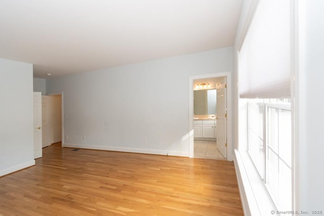 empty room with light wood-type flooring