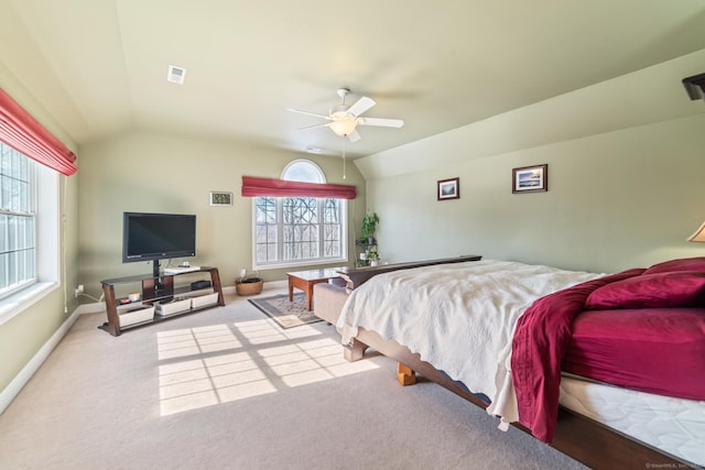 bedroom with carpet floors, vaulted ceiling, baseboards, and ceiling fan