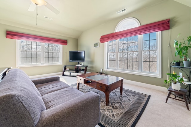 living room with baseboards, visible vents, vaulted ceiling, and carpet flooring