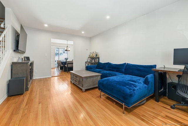 living room with light hardwood / wood-style flooring