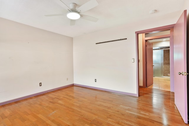 spare room with ceiling fan and light hardwood / wood-style floors