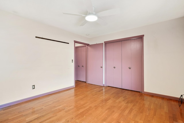 unfurnished bedroom featuring a closet, ceiling fan, and light wood-type flooring